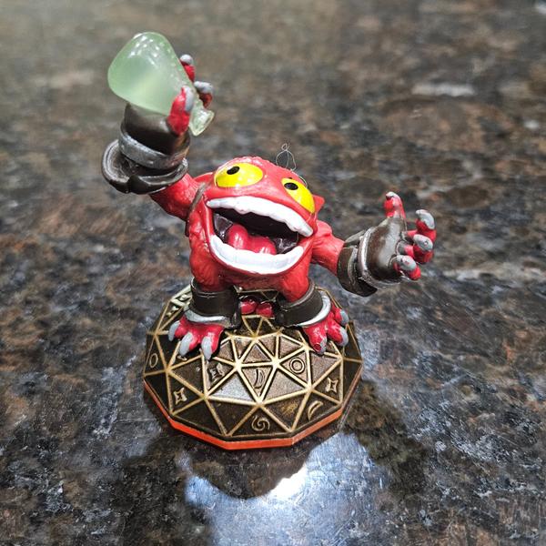 ACTIVISION S3123 A red-skinned, multi-eyed creature figure known as Punch Pop Fizz, from the Acti…